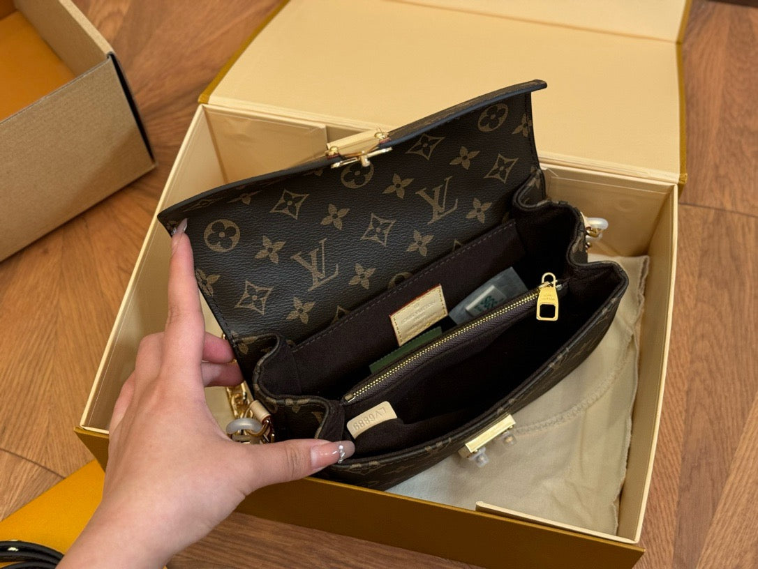 Louis Vuitton sling side handbag
